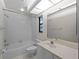Clean and bright bathroom with shower/tub combo and tiled floor at 1946 Cove Pointe Dr, Venice, FL 34293