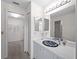 Modern bathroom with decorative sink, large mirror, and bright lighting at 1946 Cove Pointe Dr, Venice, FL 34293