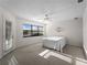Cozy bedroom with ceiling fan, large window, and outdoor access at 1946 Cove Pointe Dr, Venice, FL 34293