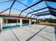 Screened-in pool and patio area with a view of the water at 1946 Cove Pointe Dr, Venice, FL 34293