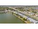 Aerial view showing condo building near lake and main road at 25225 Rampart Blvd # 1901, Punta Gorda, FL 33983