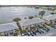 Aerial view of condo building with lakefront access and parking at 25225 Rampart Blvd # 1901, Punta Gorda, FL 33983