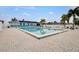 Relaxing community pool with brick patio and tropical landscaping at 25225 Rampart Blvd # 1901, Punta Gorda, FL 33983