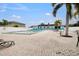 Inviting community pool area with lounge chairs and surrounding foliage at 25225 Rampart Blvd # 1901, Punta Gorda, FL 33983