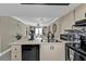 Modern kitchen with breakfast bar and stainless steel appliances at 25225 Rampart Blvd # 1901, Punta Gorda, FL 33983