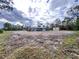 Aerial view of a house and large lot with cleared land at 27240 Tribune Blvd, Punta Gorda, FL 33955