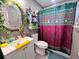 Clean bathroom with a toilet, sink and shower at 27240 Tribune Blvd, Punta Gorda, FL 33955