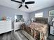 Bright bedroom with a comfortable bed and plenty of dresser space at 27240 Tribune Blvd, Punta Gorda, FL 33955