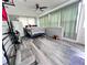 Small bedroom with a bed, refrigerator and plenty of natural light at 27240 Tribune Blvd, Punta Gorda, FL 33955
