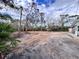 View of cleared lot with some trees in background at 27240 Tribune Blvd, Punta Gorda, FL 33955