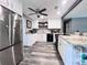 Modern kitchen with white cabinets, granite countertops, and stainless steel appliances at 27240 Tribune Blvd, Punta Gorda, FL 33955