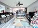 Spacious living room with hardwood floors, comfy couch, and Christmas tree at 27240 Tribune Blvd, Punta Gorda, FL 33955