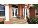 Front entry with double doors and a welcoming porch at 2842 Sancho Panza Ct, Punta Gorda, FL 33950