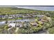 Aerial view of home and community, showcasing waterfront and surrounding houses at 3230 Bay Ridge Way, Port Charlotte, FL 33953