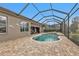 Inviting screened pool and spa with a relaxing view at 3230 Bay Ridge Way, Port Charlotte, FL 33953