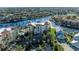 Aerial view of condo building, pool, and surrounding neighborhood at 3340 Wood Thrush Dr # 323, Punta Gorda, FL 33950