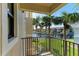 Private balcony overlooking the water and tropical landscape at 3340 Wood Thrush Dr # 323, Punta Gorda, FL 33950