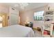 Bedroom with a queen bed, light walls, and a ceiling fan at 3340 Wood Thrush Dr # 323, Punta Gorda, FL 33950