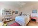 Bedroom with queen-size bed, built-in shelving, and ceiling fan at 3340 Wood Thrush Dr # 323, Punta Gorda, FL 33950