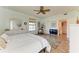 Bright bedroom with hardwood floors, ceiling fan and en-suite bathroom at 3340 Wood Thrush Dr # 323, Punta Gorda, FL 33950