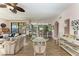 Open concept dining area with glass table and chairs near kitchen at 3340 Wood Thrush Dr # 323, Punta Gorda, FL 33950