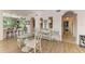 Charming dining area with unique chairs and access to kitchen at 3340 Wood Thrush Dr # 323, Punta Gorda, FL 33950
