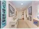 Light and airy hallway with coastal-themed art at 3340 Wood Thrush Dr # 323, Punta Gorda, FL 33950