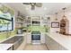 Modern kitchen featuring stainless steel appliances and green tile backsplash at 3340 Wood Thrush Dr # 323, Punta Gorda, FL 33950