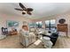 Living room features hardwood floors and ceiling fan at 3340 Wood Thrush Dr # 323, Punta Gorda, FL 33950