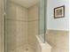 Large walk-in shower with glass enclosure and tile surround at 3340 Wood Thrush Dr # 323, Punta Gorda, FL 33950