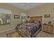 Cozy bedroom with natural light, a ceiling fan and tiled flooring at 3730 Whippoorwill Blvd, Punta Gorda, FL 33950