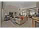 Spacious living room with tile floors, neutral tones, and abundant natural light from nearby windows at 3730 Whippoorwill Blvd, Punta Gorda, FL 33950