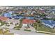 Stunning aerial view showcasing a waterfront property and neighborhood at 3730 Whippoorwill Blvd, Punta Gorda, FL 33950