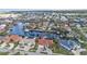 Wide canal and neighborhood aerial view, showcasing the property at 3730 Whippoorwill Blvd, Punta Gorda, FL 33950
