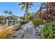 Landscaped backyard with walkway leading to the canal at 3730 Whippoorwill Blvd, Punta Gorda, FL 33950