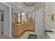 Elegant bathroom with dual vanities and a corner shower at 3730 Whippoorwill Blvd, Punta Gorda, FL 33950