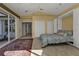 Guest bedroom with a wall bed, built-in storage, and access to the lanai at 3730 Whippoorwill Blvd, Punta Gorda, FL 33950
