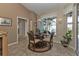 Bright breakfast nook boasts a table for four and garden views at 3730 Whippoorwill Blvd, Punta Gorda, FL 33950