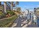Landscaped canal-front walkway leads to the dock at 3730 Whippoorwill Blvd, Punta Gorda, FL 33950