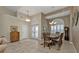 Elegant dining room with a spacious table and hardwood floors at 3730 Whippoorwill Blvd, Punta Gorda, FL 33950