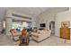 Spacious living room with high ceilings, comfortable seating, and large windows at 3730 Whippoorwill Blvd, Punta Gorda, FL 33950
