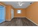 Bedroom with wood-look floors and ceiling fan at 412 Scarlet Sage, Punta Gorda, FL 33955