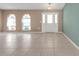 Bright living room featuring tile floors and arched windows at 412 Scarlet Sage, Punta Gorda, FL 33955