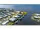 Picture perfect waterfront home with private dock, beautiful landscaping, and water access at 4431 Gardner Dr, Port Charlotte, FL 33952