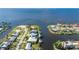 Stunning aerial view of waterfront home with private dock and lush landscaping at 4431 Gardner Dr, Port Charlotte, FL 33952