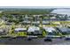 Charming waterfront home with boat dock, tropical landscaping, and screened in pool at 4431 Gardner Dr, Port Charlotte, FL 33952