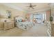 Main bedroom with soft carpet flooring and sliding glass doors leading to the screened in lanai and pool at 4431 Gardner Dr, Port Charlotte, FL 33952