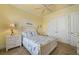 Bedroom with ceiling fan, art, and double door closet at 4431 Gardner Dr, Port Charlotte, FL 33952