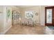 Dining room with neutral paint, bright window, and decorative china cabinet at 4431 Gardner Dr, Port Charlotte, FL 33952
