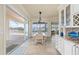 Bright dining area with sliding glass doors leading to a screened lanai and a water view at 4431 Gardner Dr, Port Charlotte, FL 33952